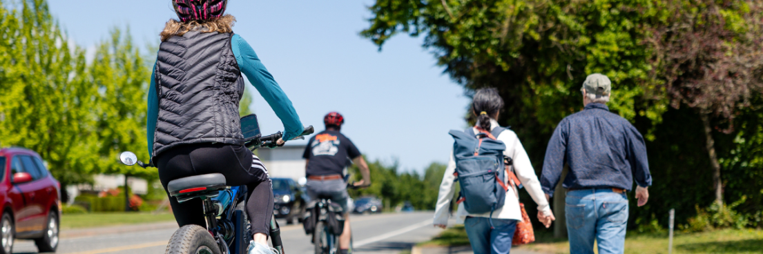 People of different ages driving, walking and cycling
