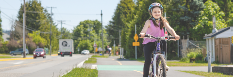 Kid rides bike along Mount Newton Pathway Phase 1